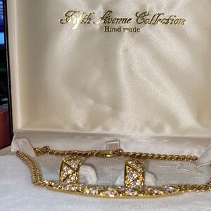 Gold necklace  and  earrings with brilliant crystals